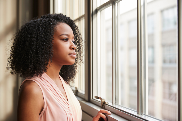 Woman looking out a window