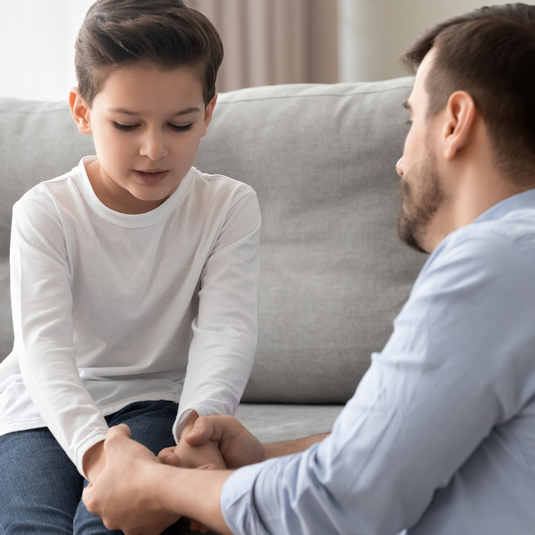 Man and child holding hands