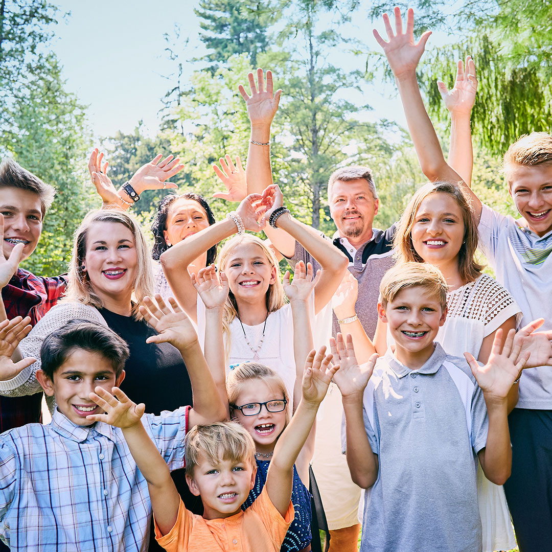 Group of people raising their hands