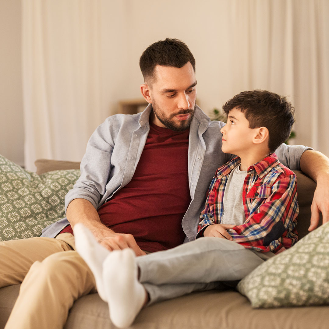 Man and child sitting together