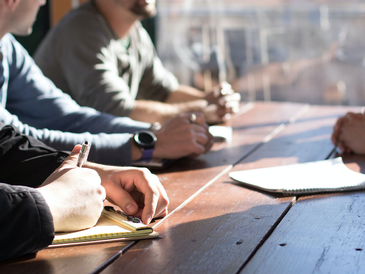 People sitting at a table having a meeting