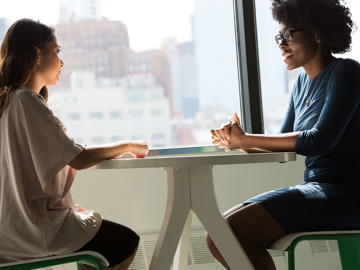 Two women sitting at a table