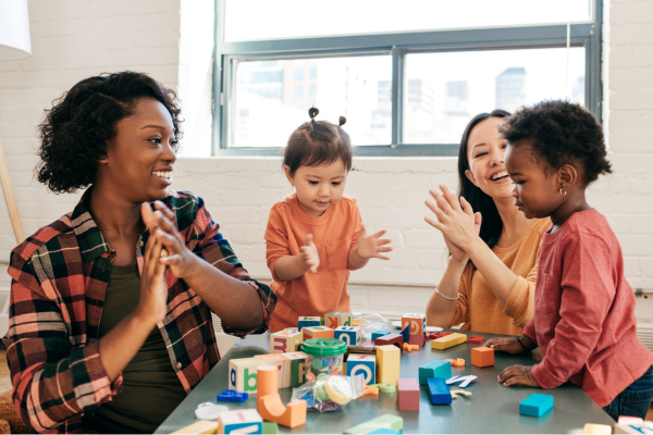 Adults playing with children