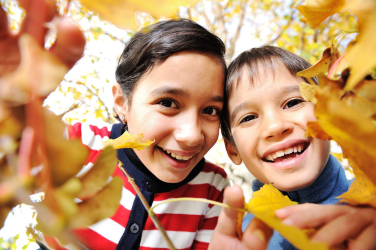 Children with leaves