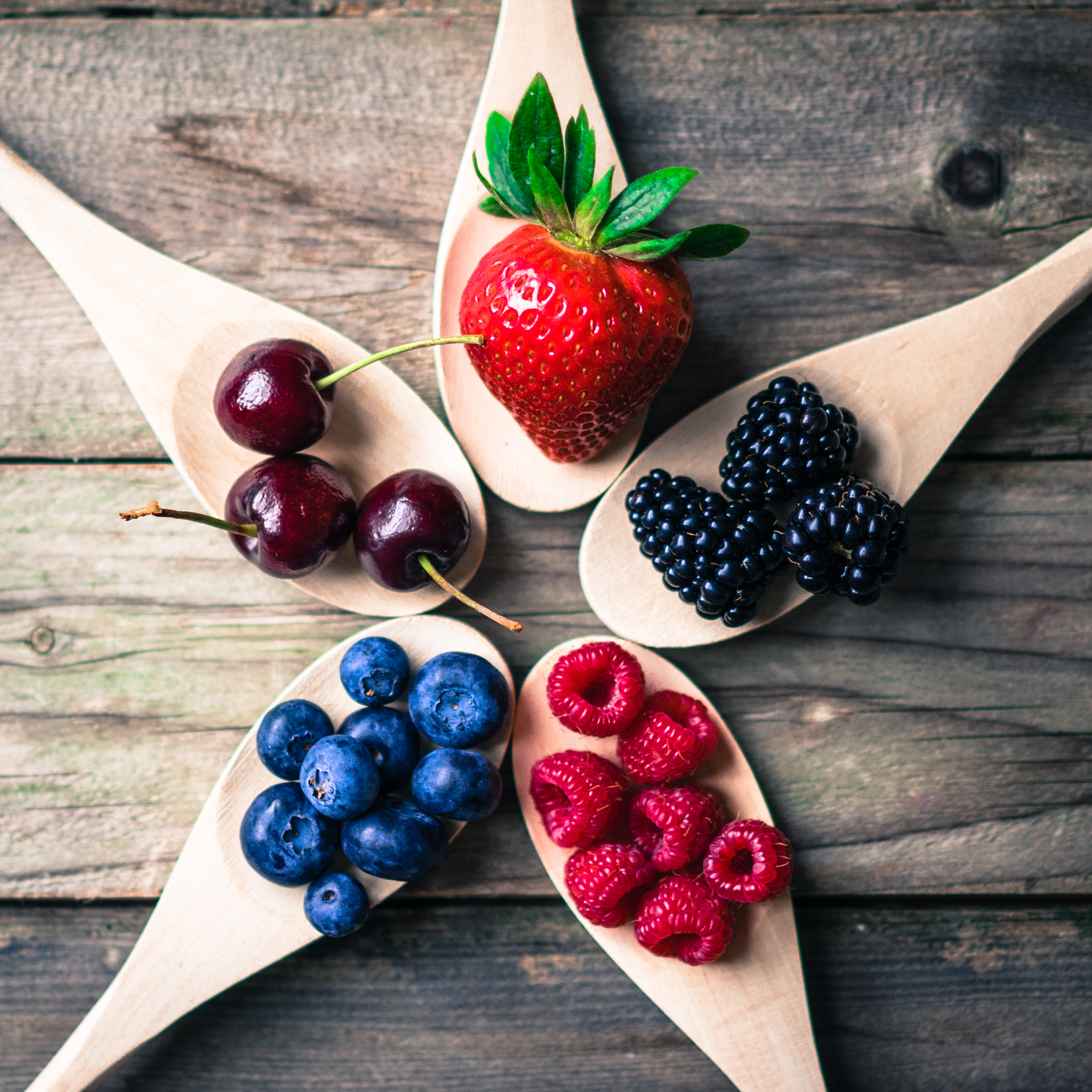 fruit on wooden spoons