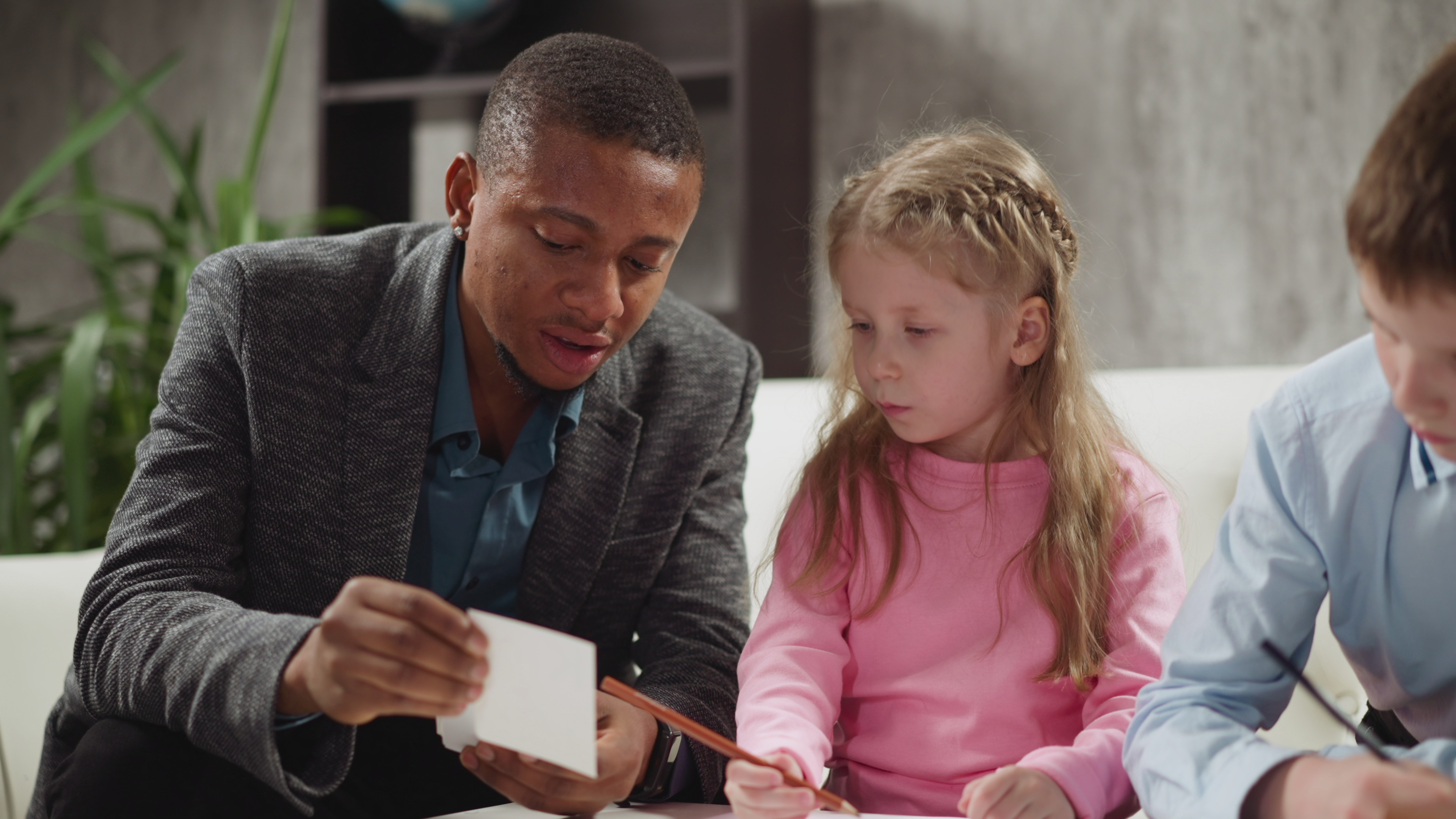 Tutor using flash cards with child