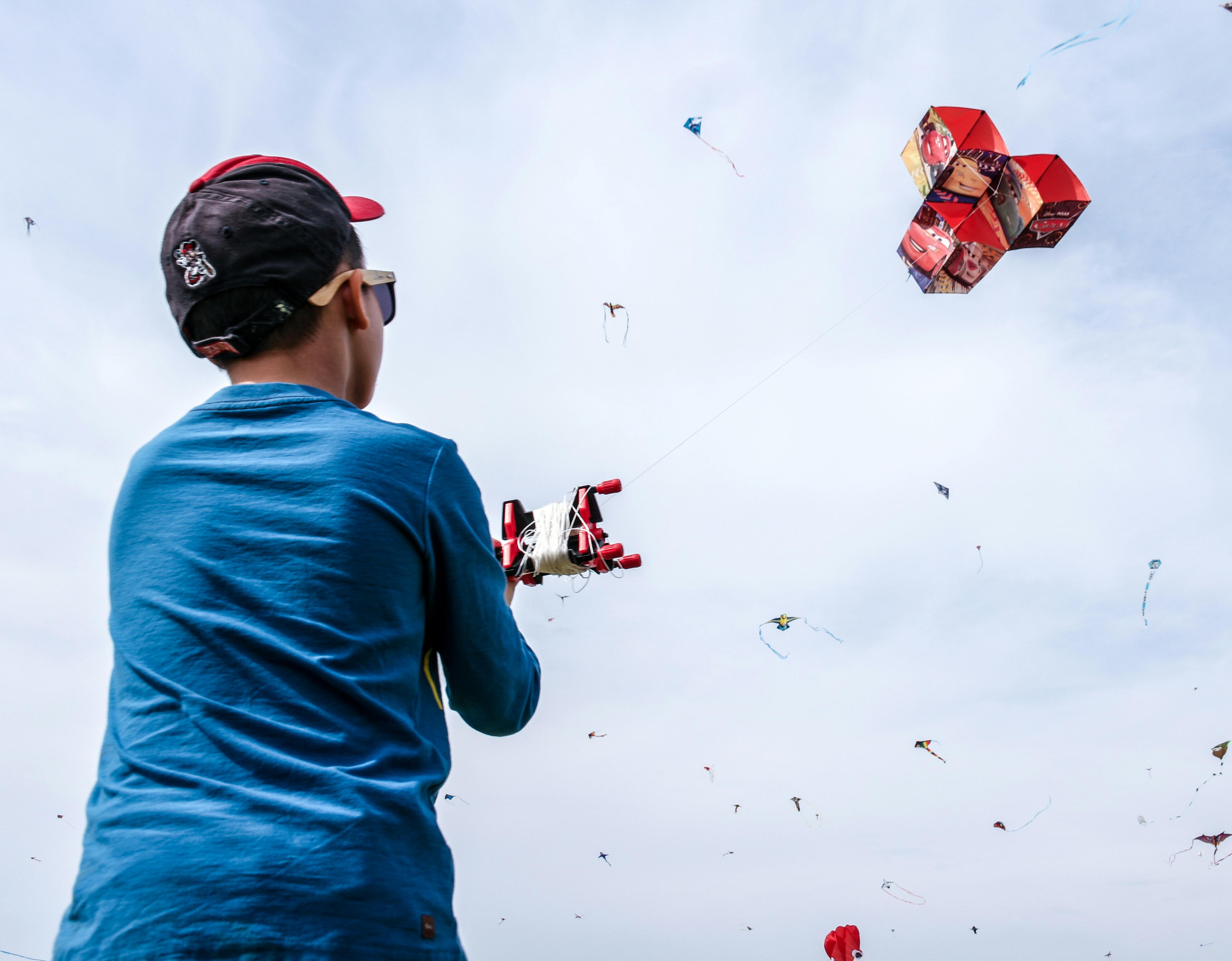 child flying a kite