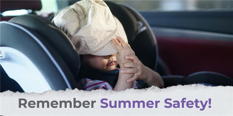 child in car seat with a hat over his face