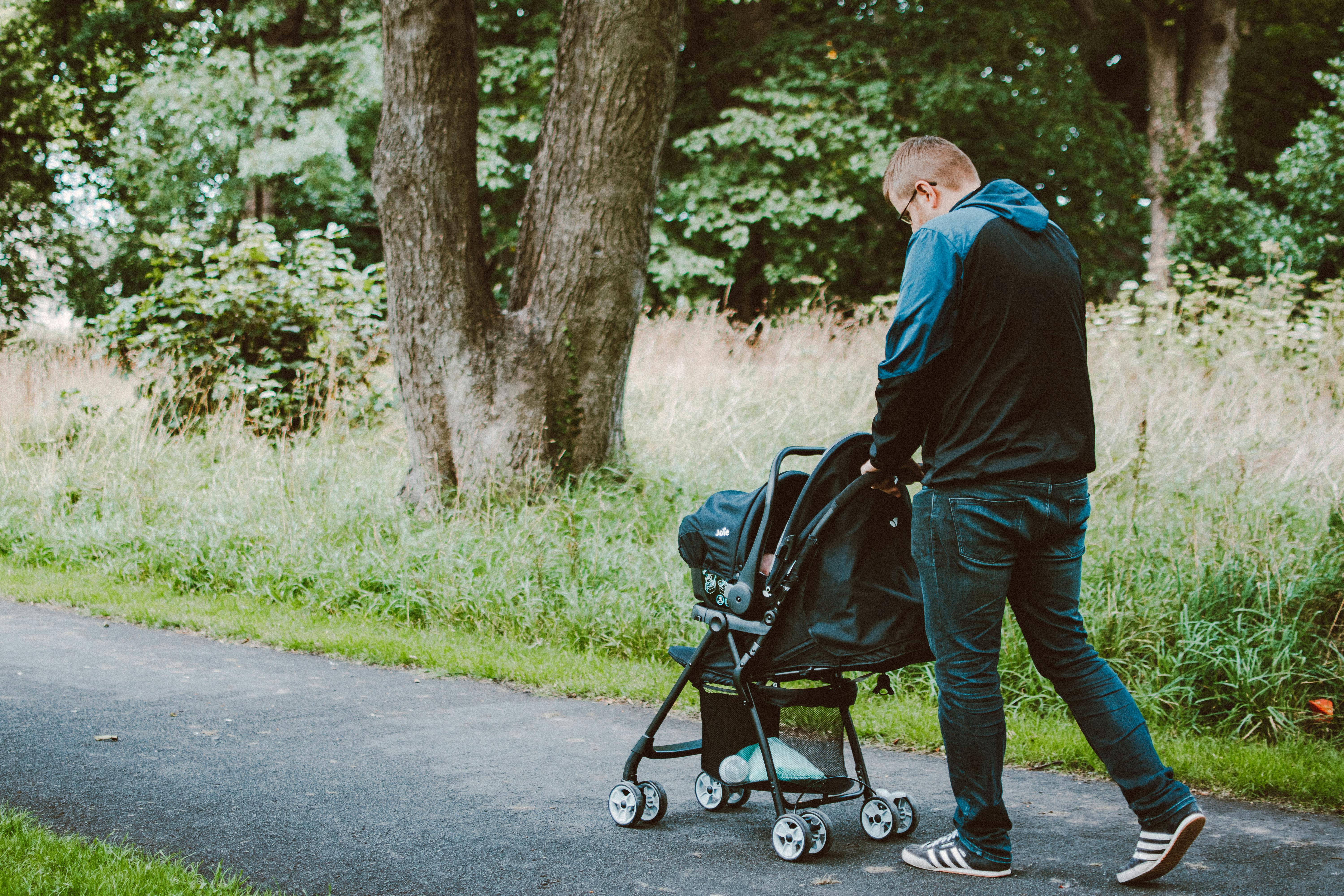 man pushing a stroller