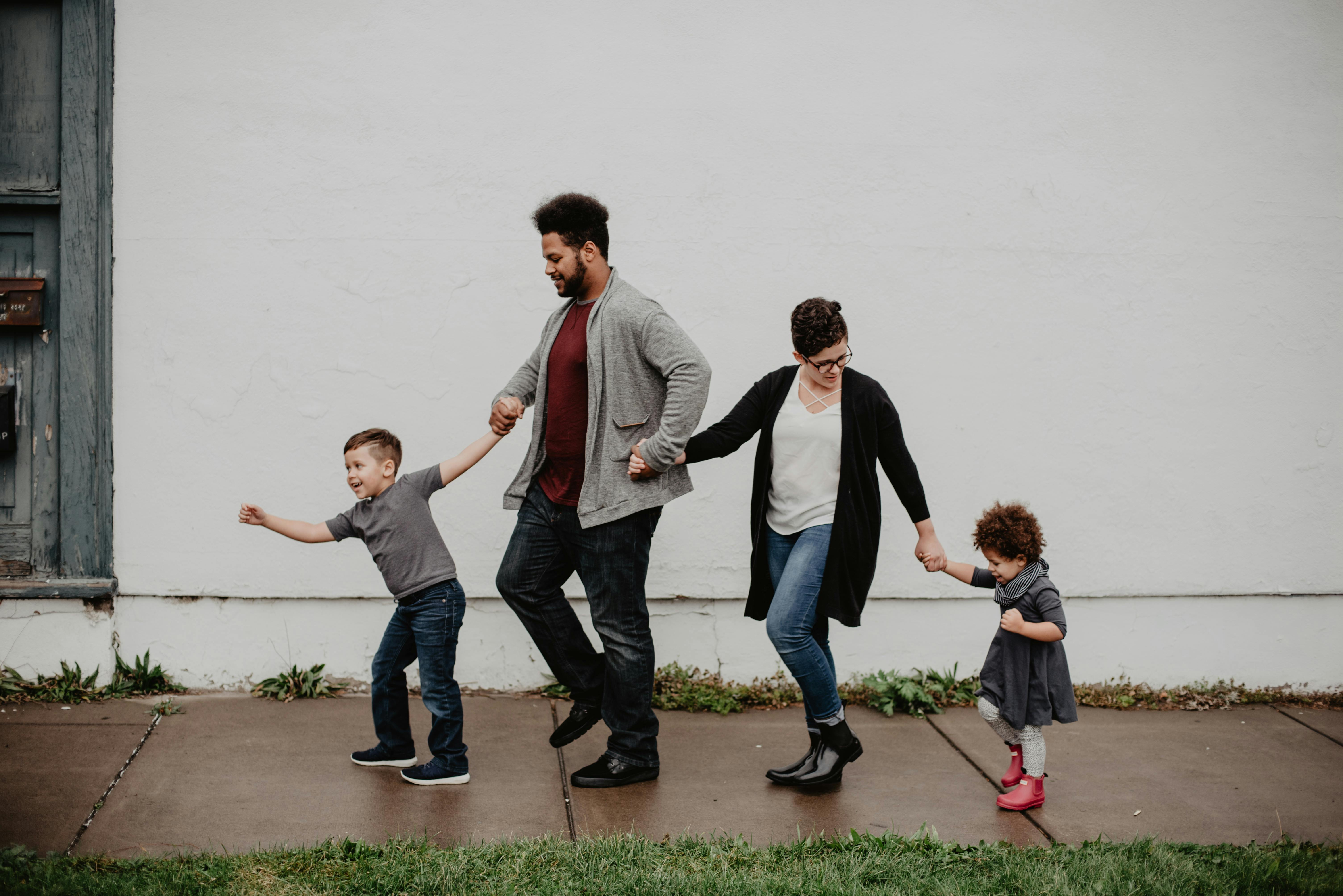 family walking holding hands