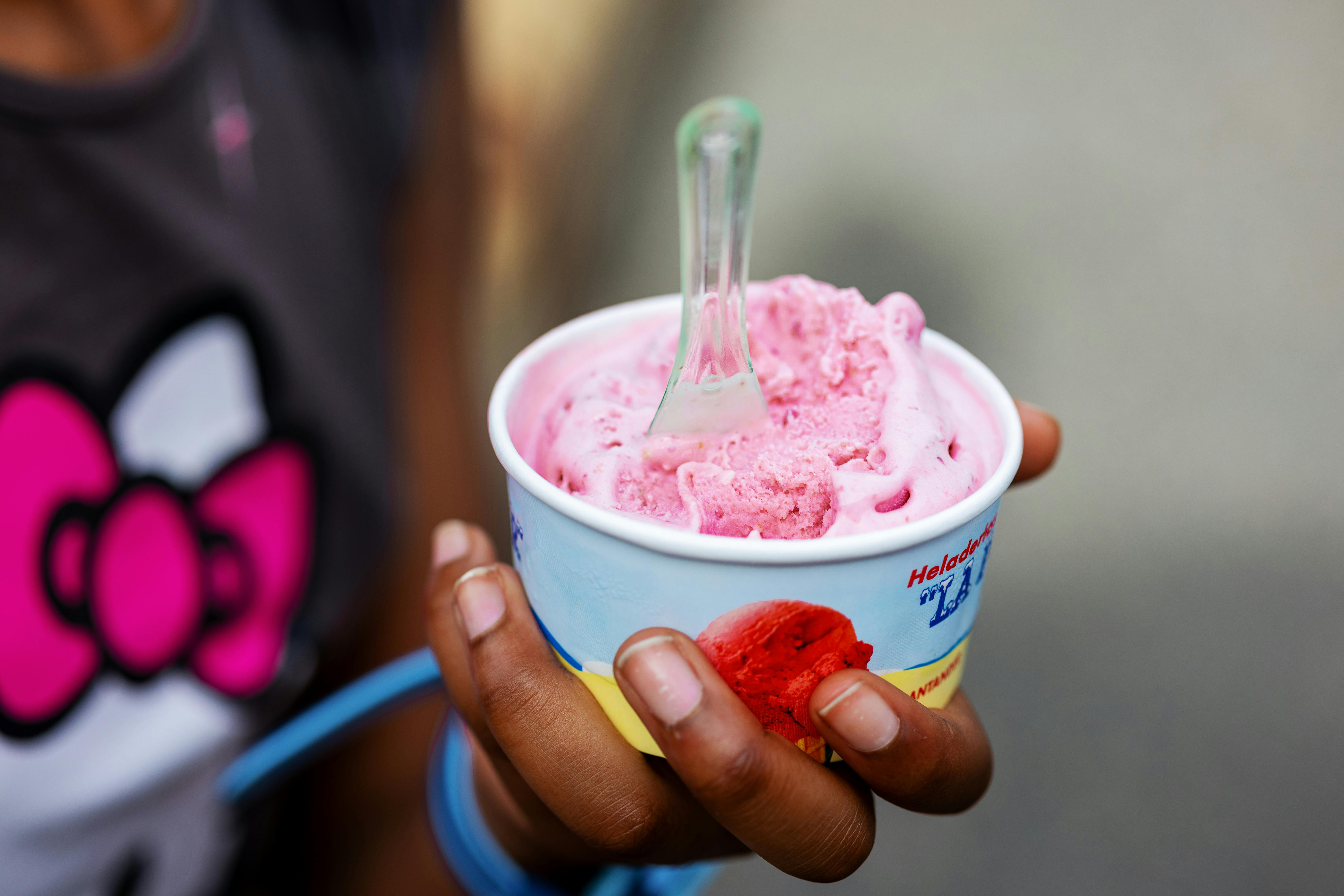 child holding ice cream cup