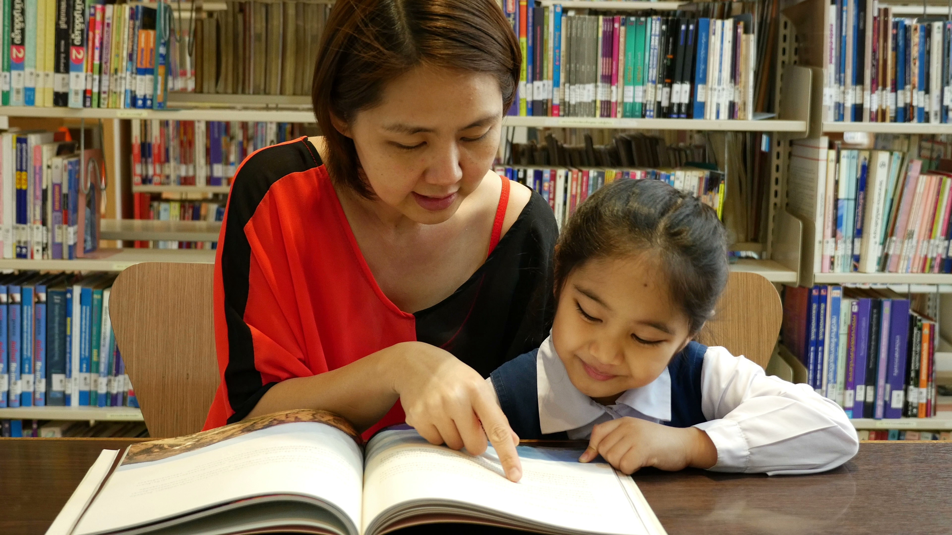 Woman reading with child