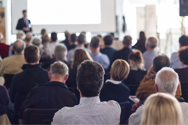 People listening to a presentation