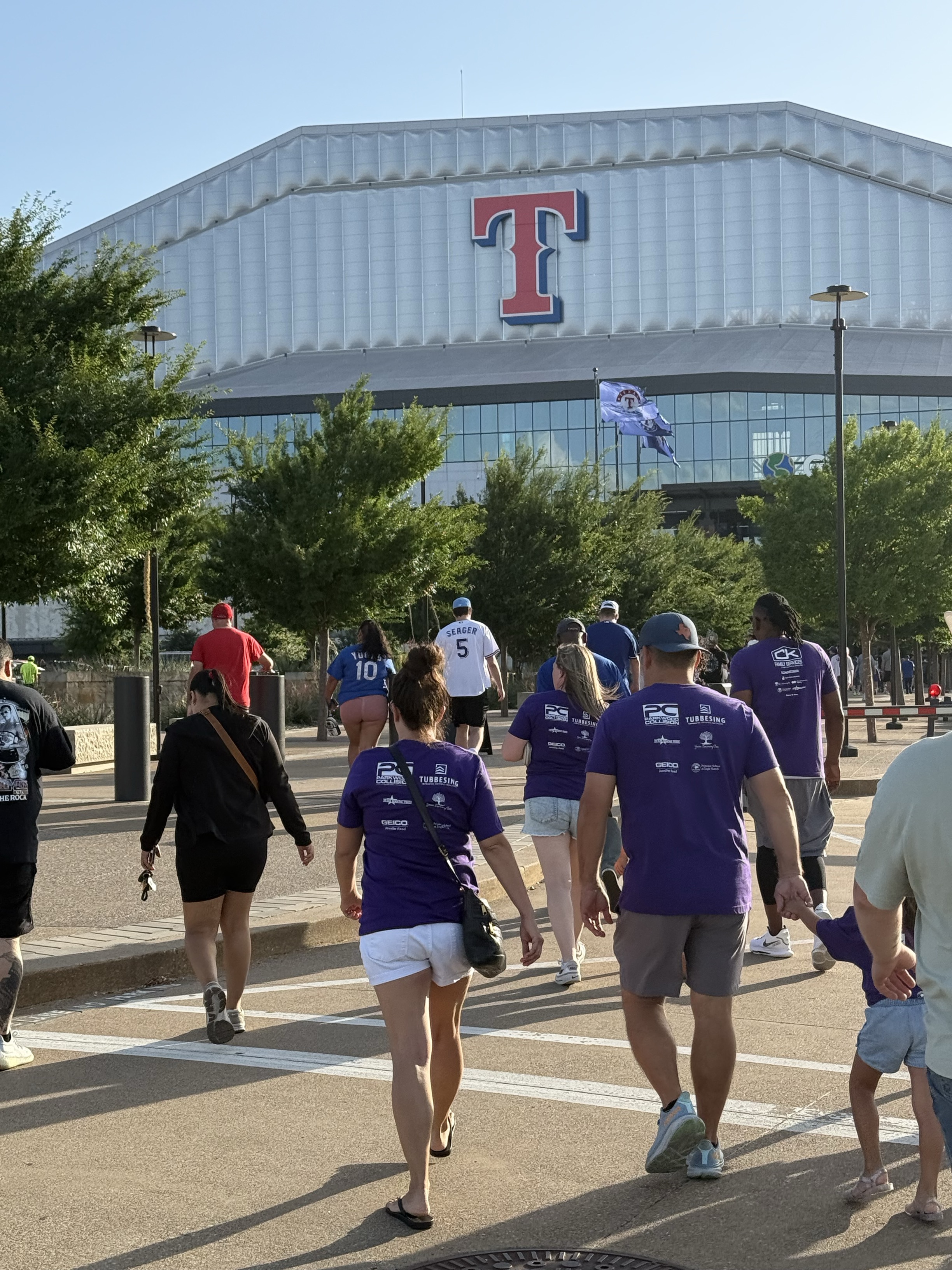 family walking into the rangers game