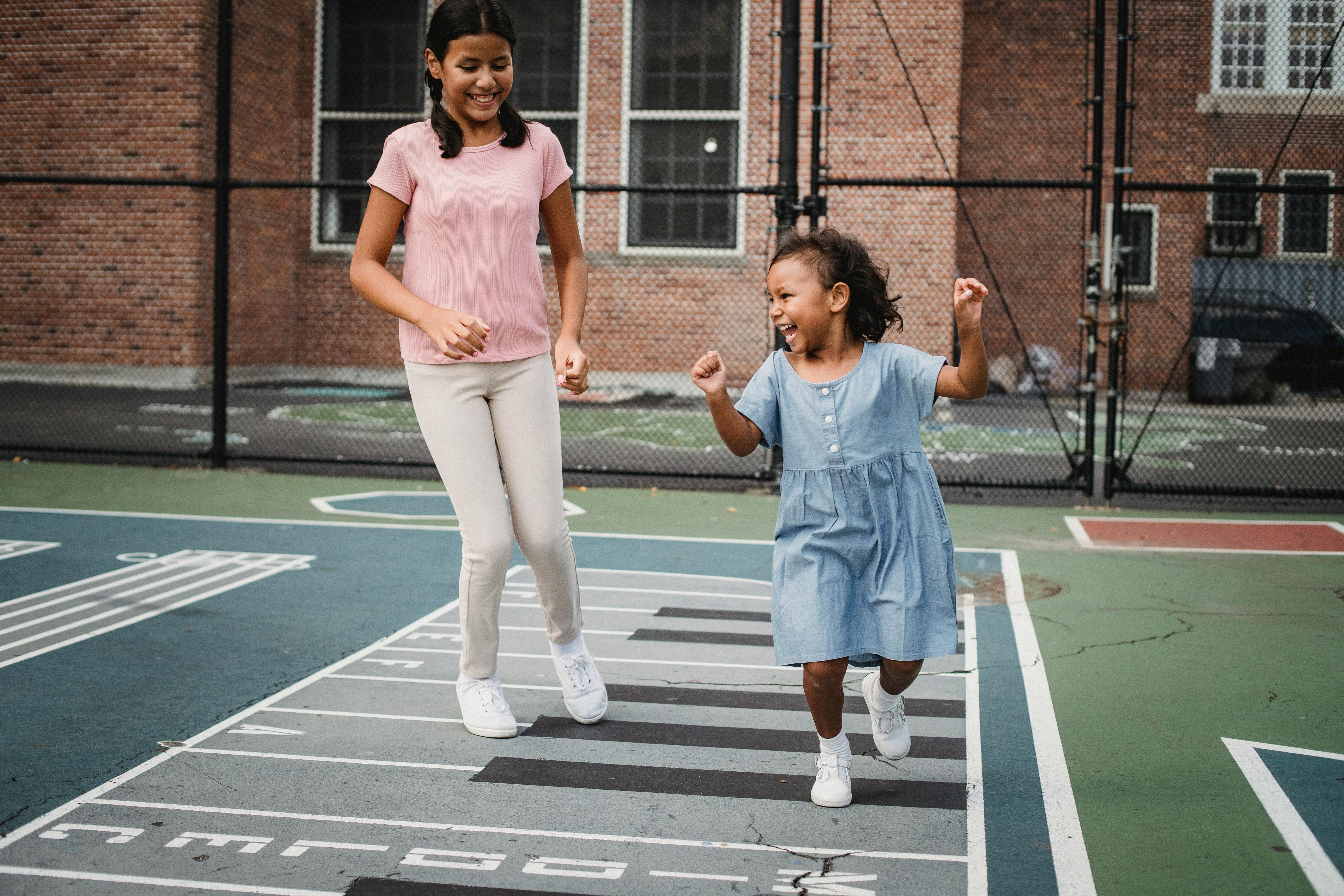 Little girls playing hopscotch