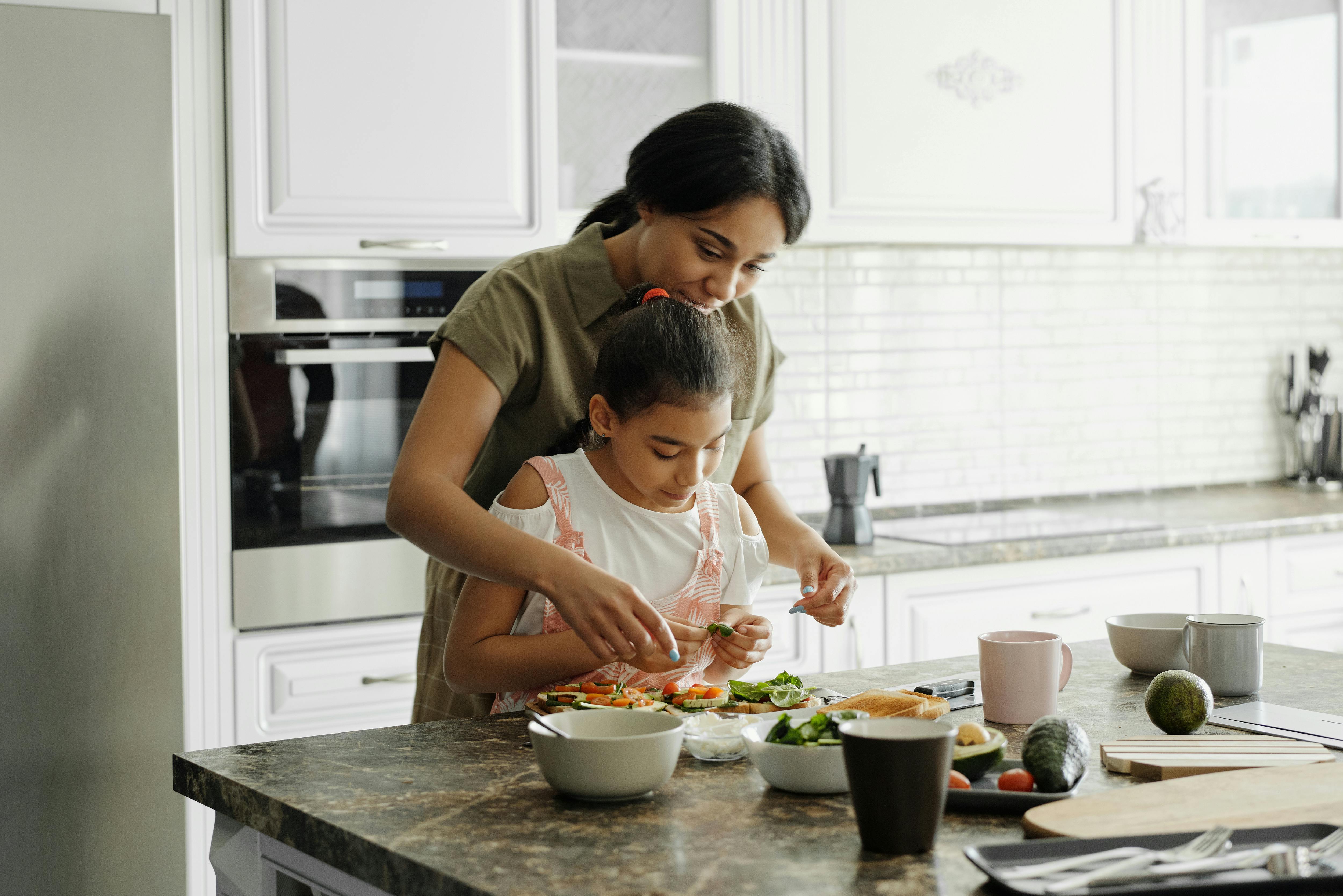 mother and child preparing food