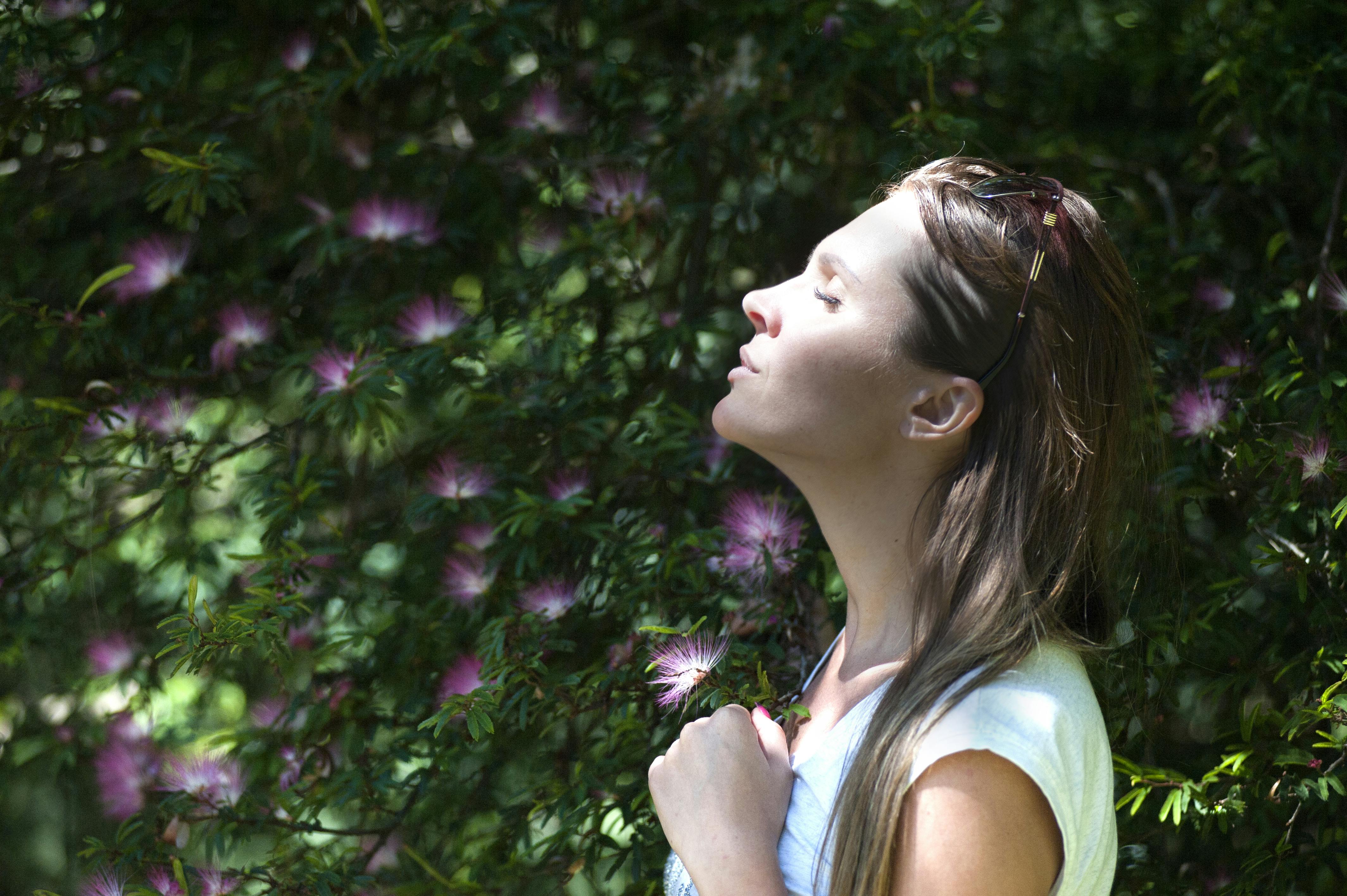 woman taking a deep breath