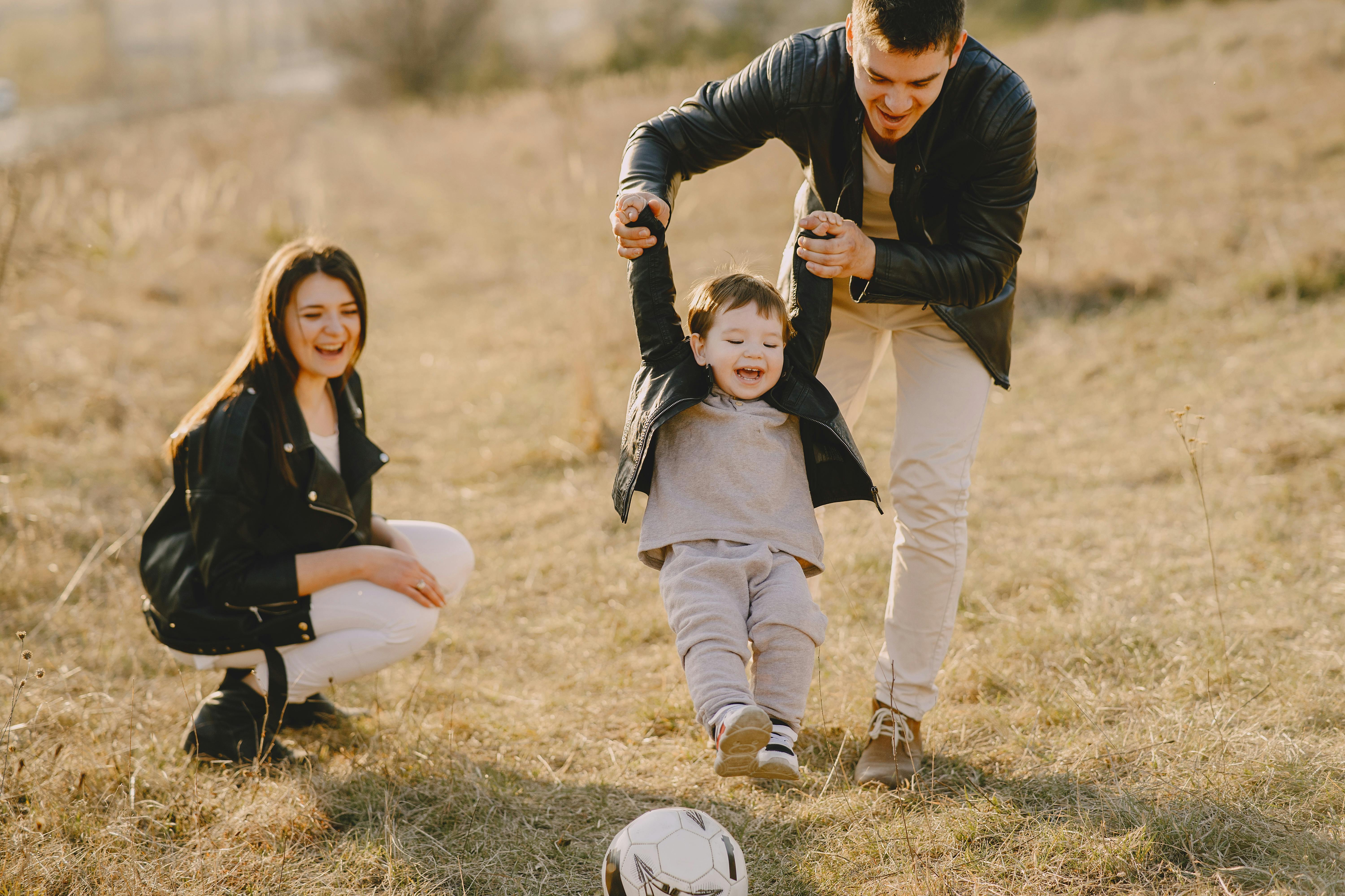 parents playing with a young boy
