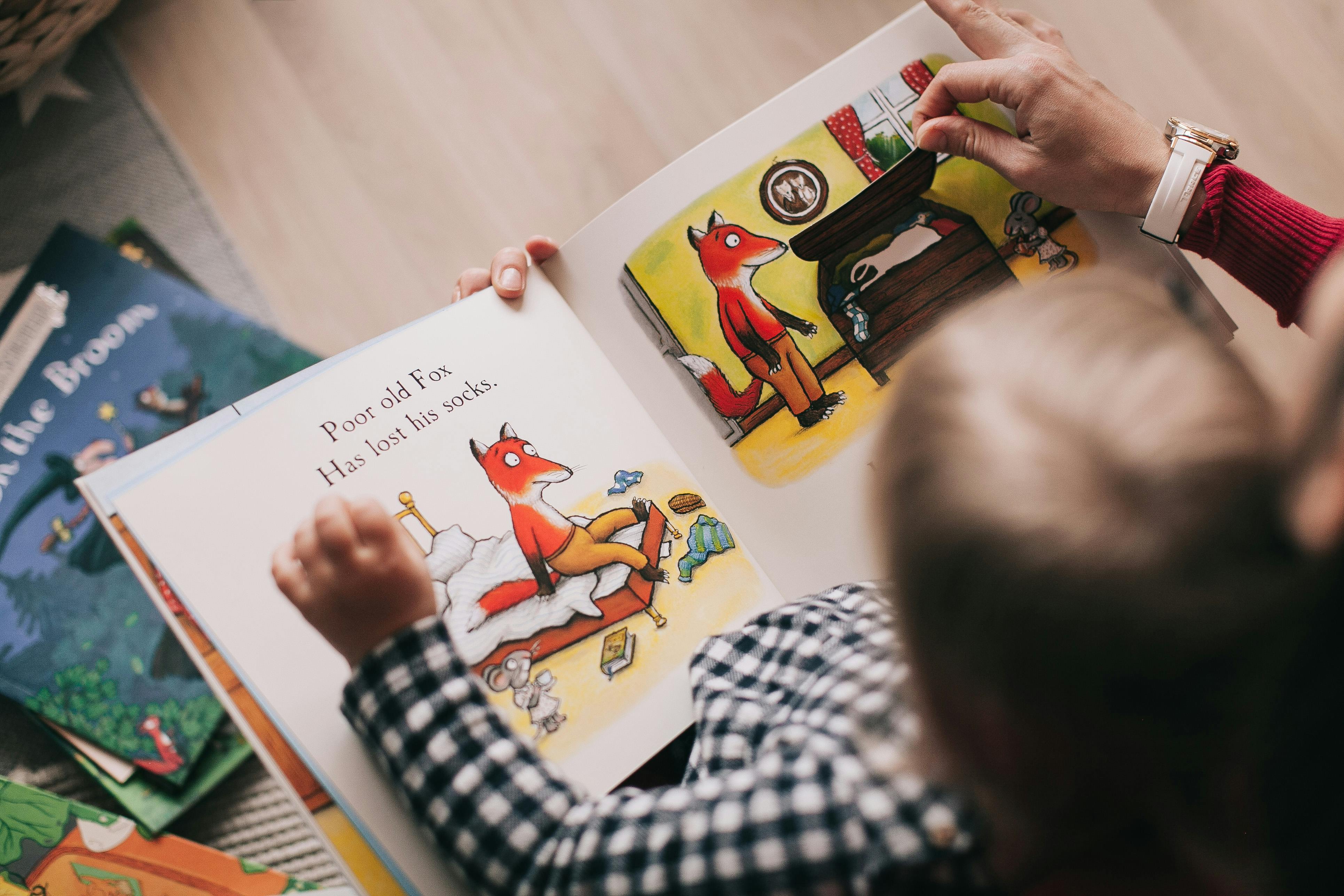 child with a picture book