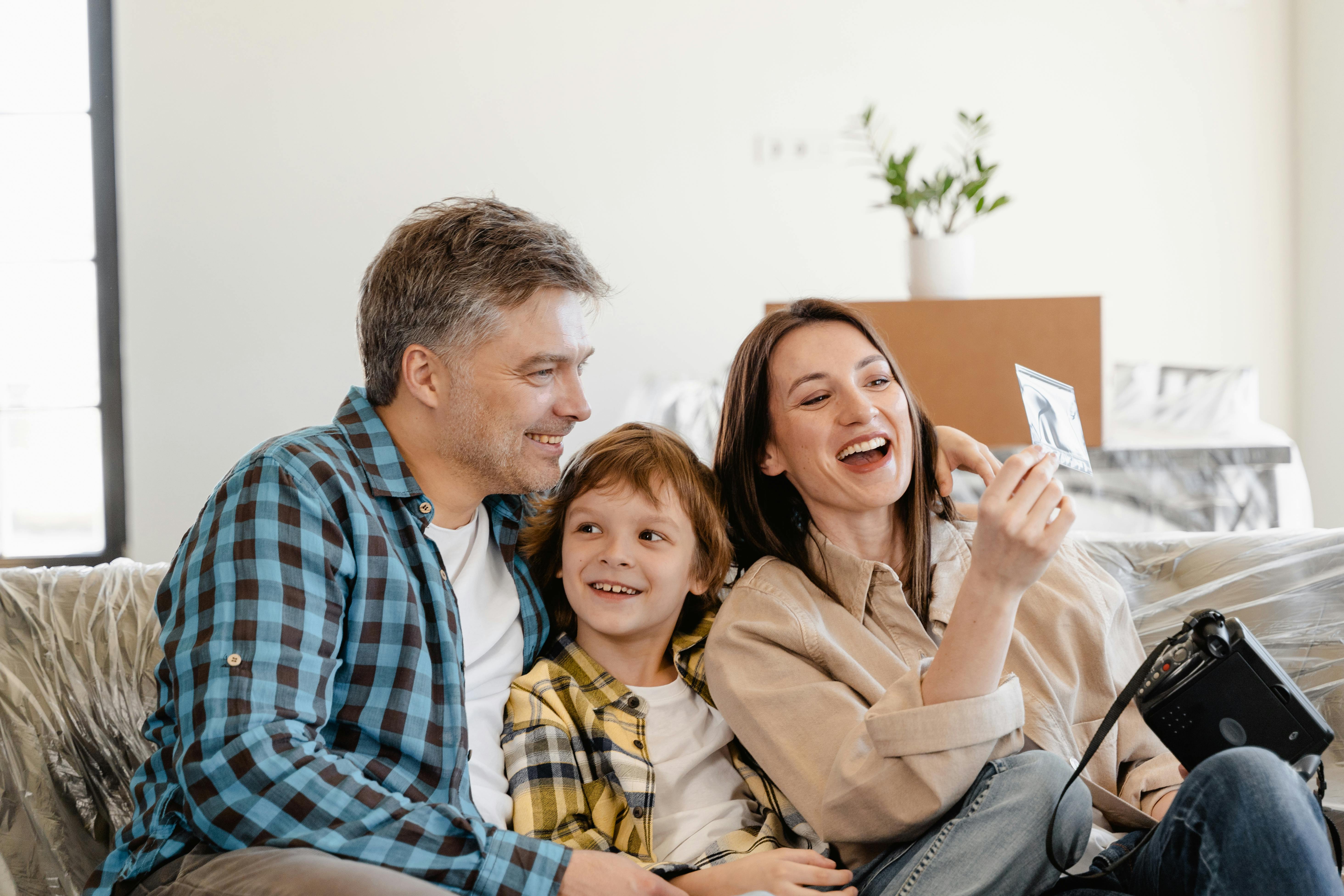 parents and a boy smiling