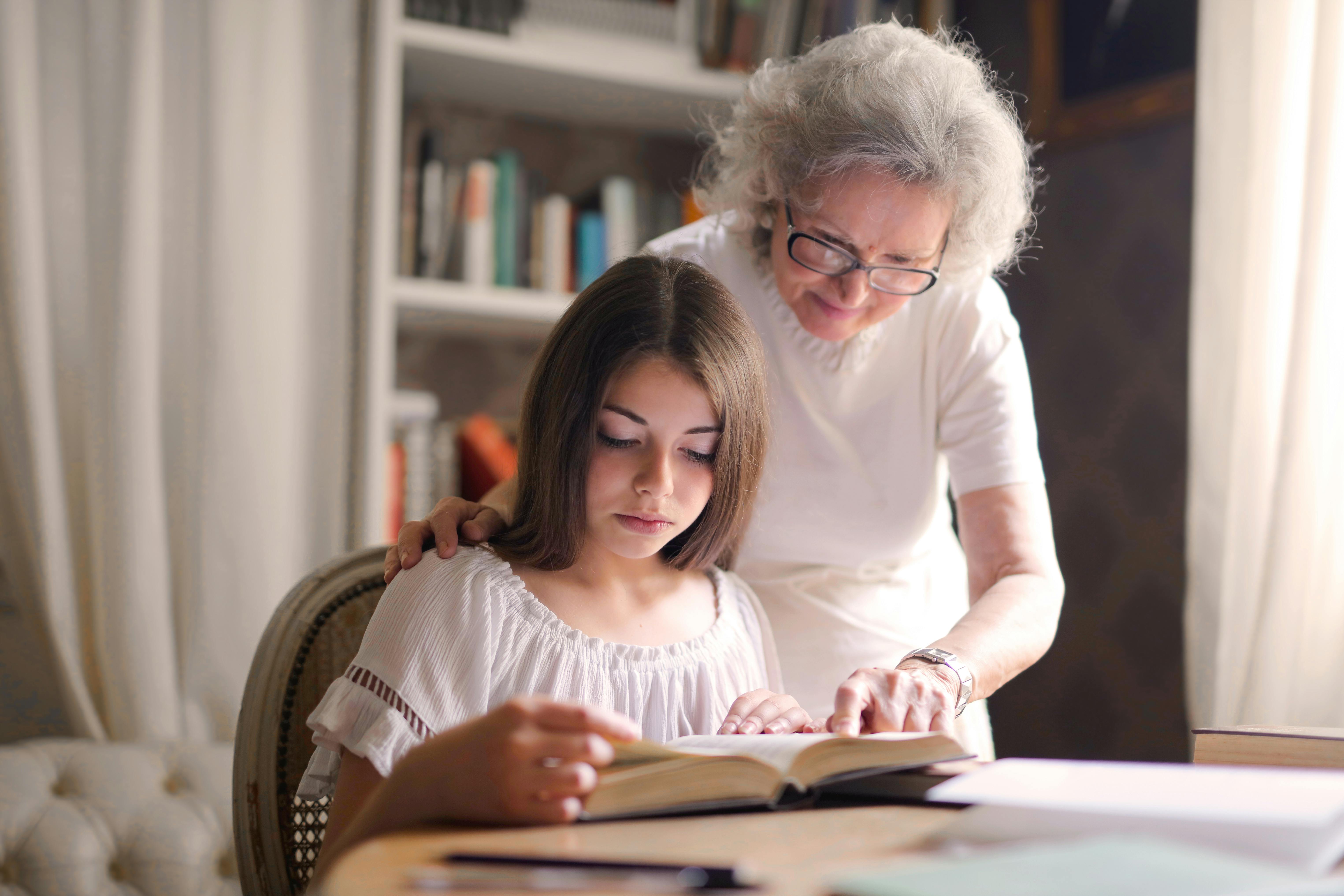 grandmother and girl reading