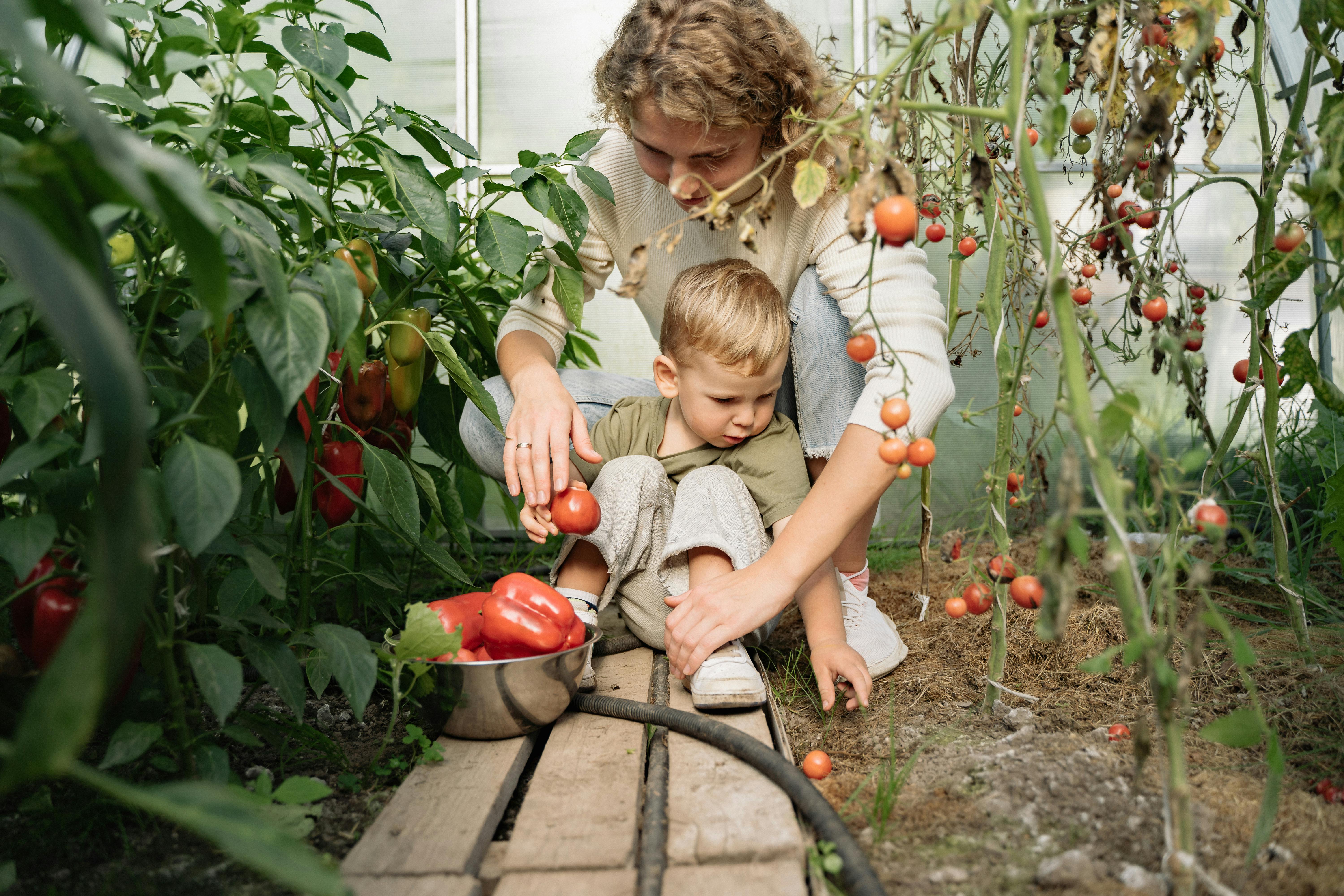 child and mother in a garden