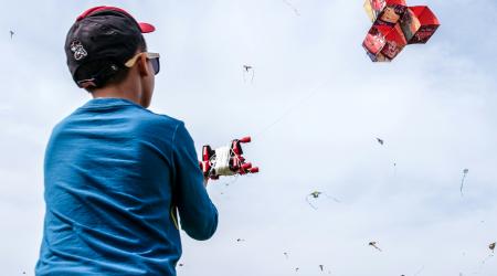 child flying a kite