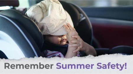 child in car seat with a hat over his face