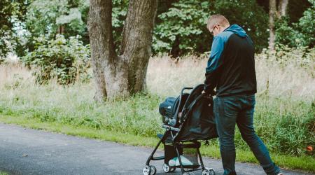 man pushing a stroller