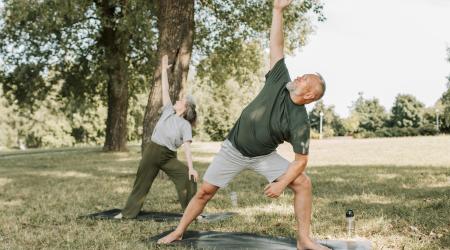 man and woman exercising in the park