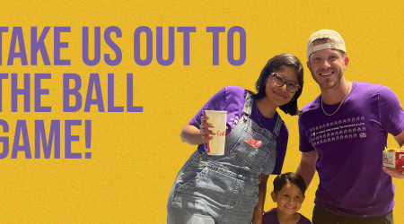 Family in purple shirts at a baseball game