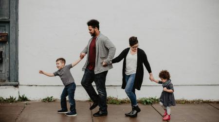 family walking holding hands