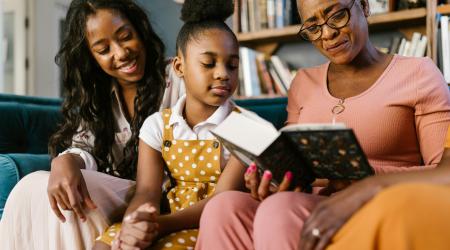 family reading with grandmother